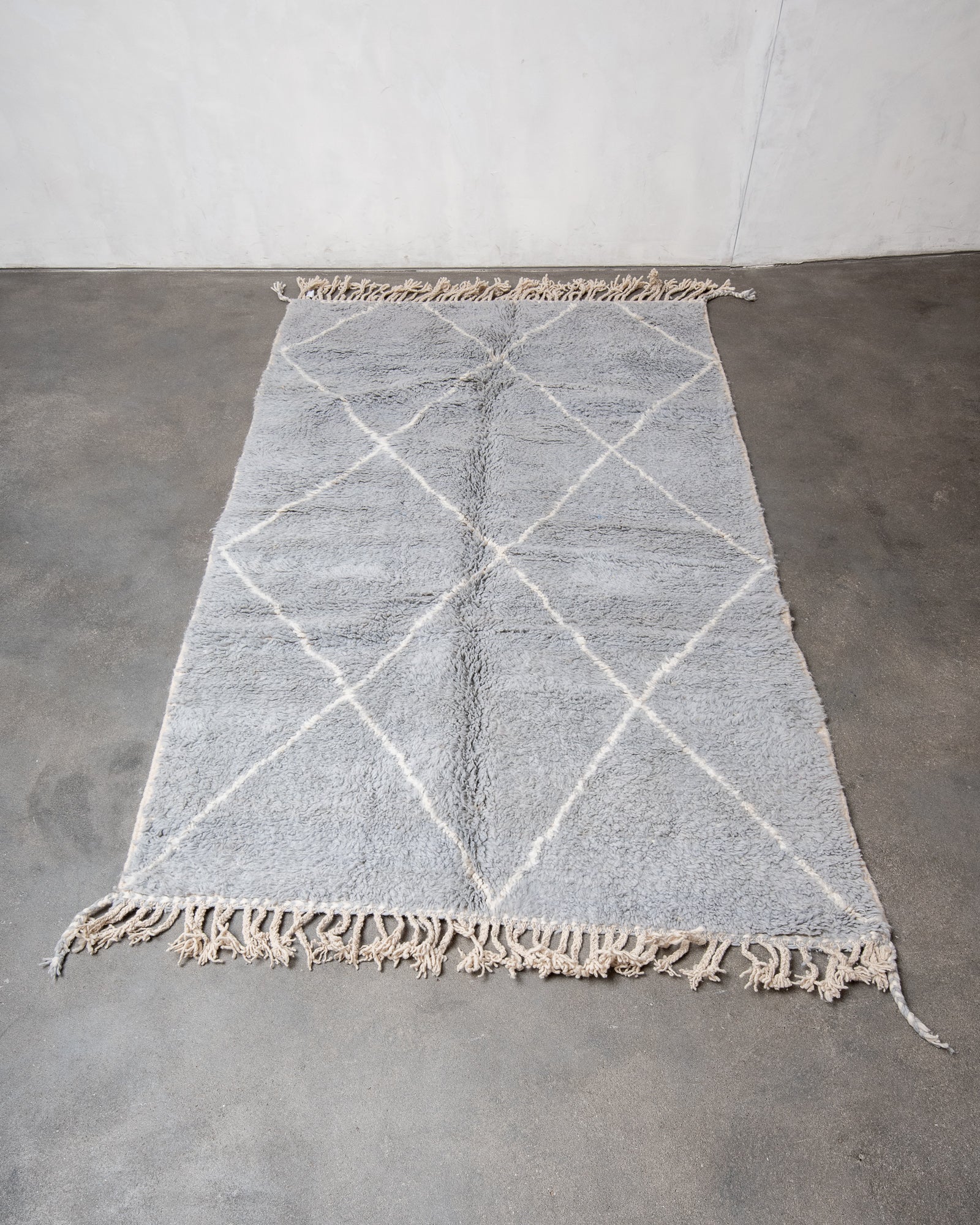 Modern, designer, handcrafted Berber rug from Morocco. Beniourain carpet with beautiful colours and patterns and fluffy wool texture.